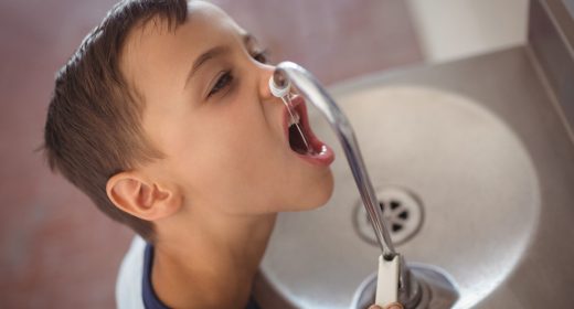high-angle-view-of-boy-drinking-water-from-faucet-2026-01-11-10-31-21-utc